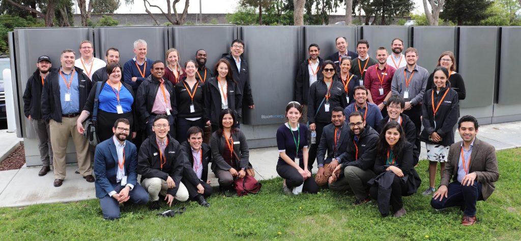 Students in front of Bloom Energy's storage batteries.