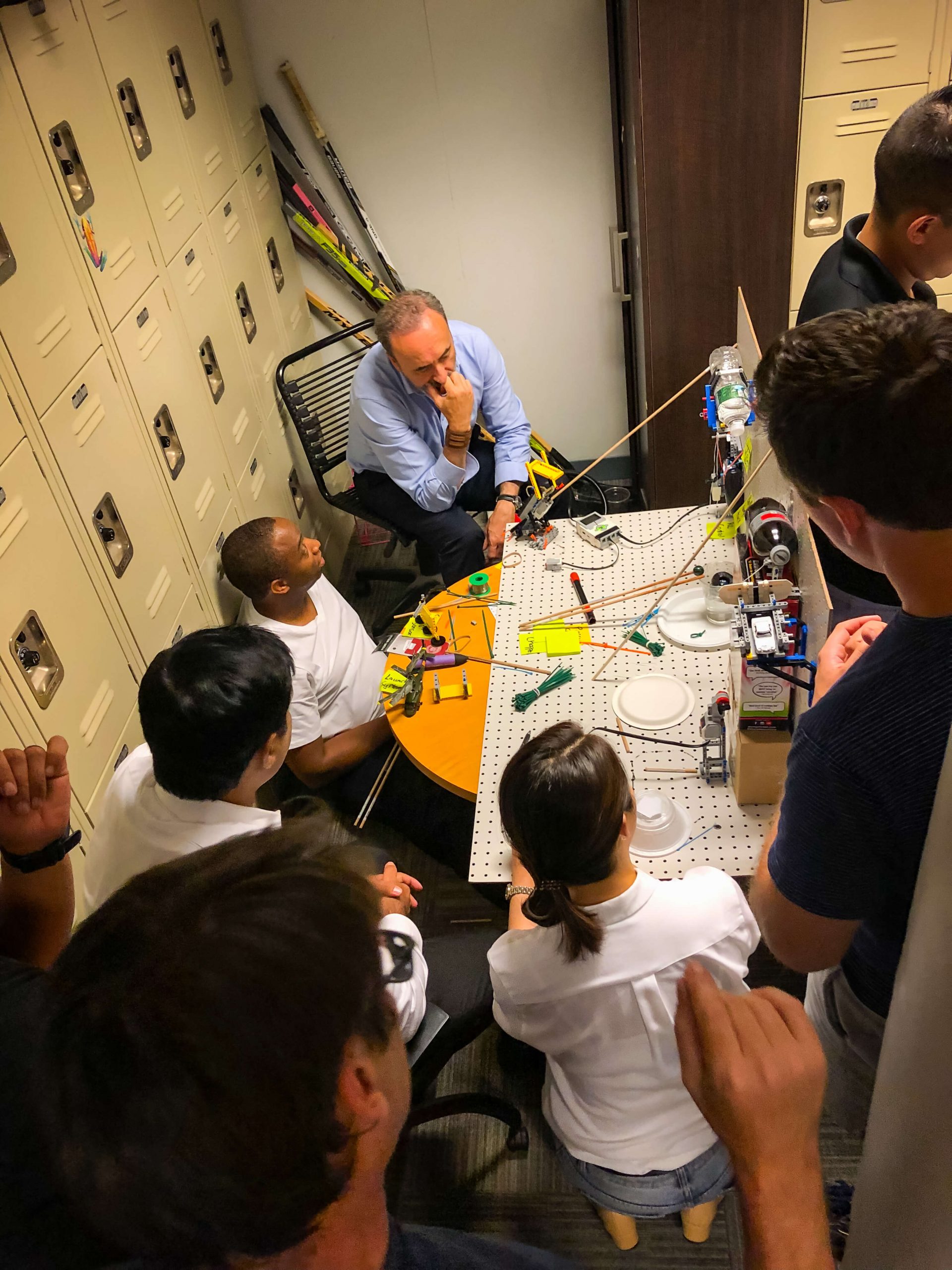 Students working on a complicated device