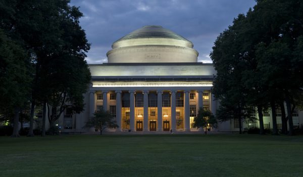 The MIT Dome seen at twilight against a dark blue sky.